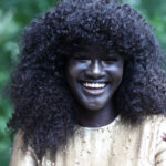 Diop was told by cousins to lighten her skin with beauty products, but her sister told her not to because her skin was beautiful.